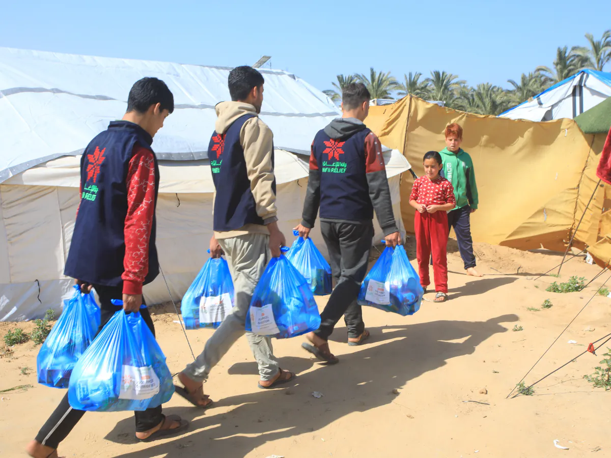Delivering assistance to displaced families, Gaza Strip